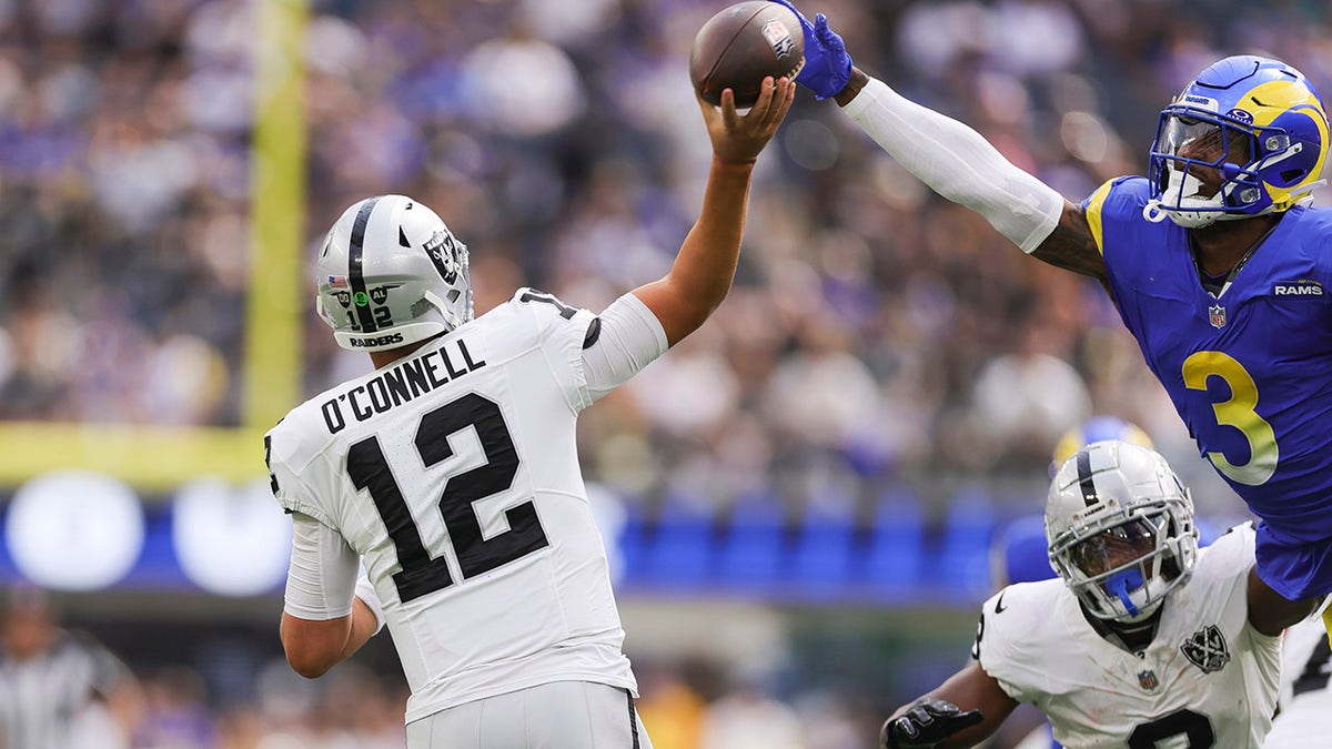 In Inglewood, California, on Oct. 20, 2024, Las Vegas Raiders quarterback Aidan O'Connell makes a pass as Los Angeles Rams safety Kam Curl tries to block it during the first half of the game. Source: Fox News